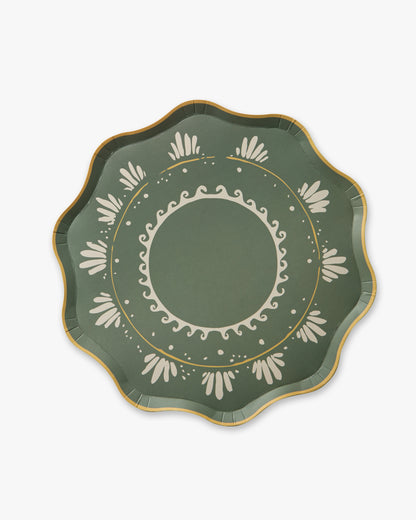Decorative green plate with white patterns on a white background
