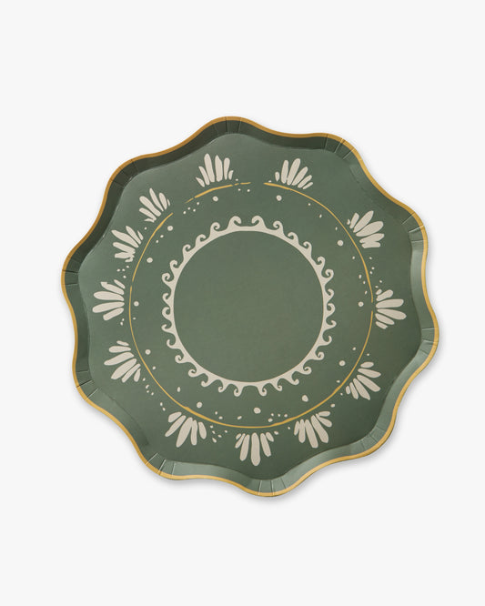 Decorative green plate with white patterns on a white background