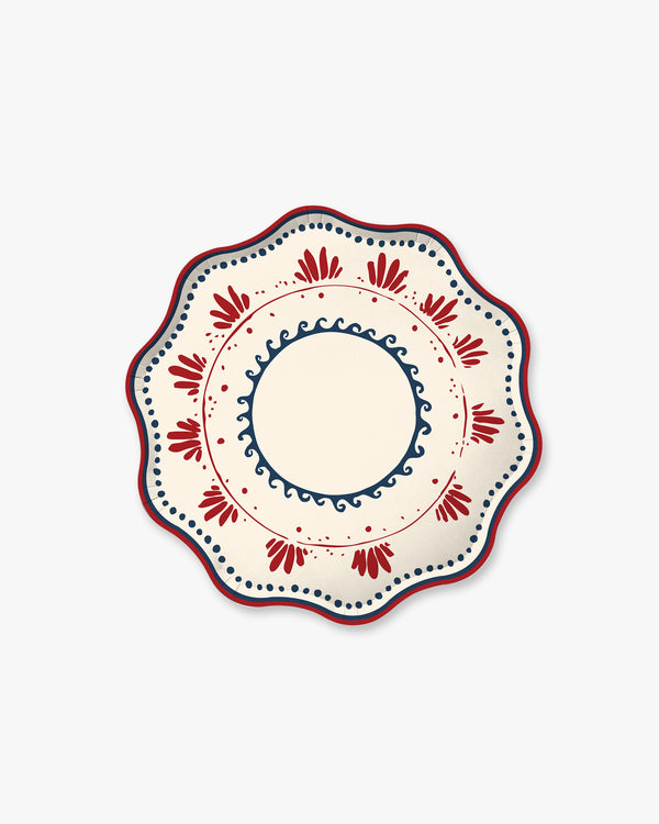 Decorative plate with red and blue patterns on a white background