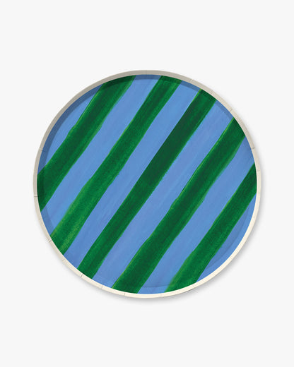 Round ceramic plate with blue and green striped pattern on a white background