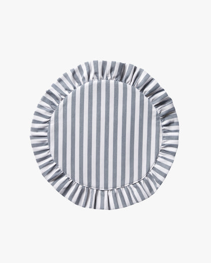 Round blue and white striped linen placemat with ruffled edge on a white background