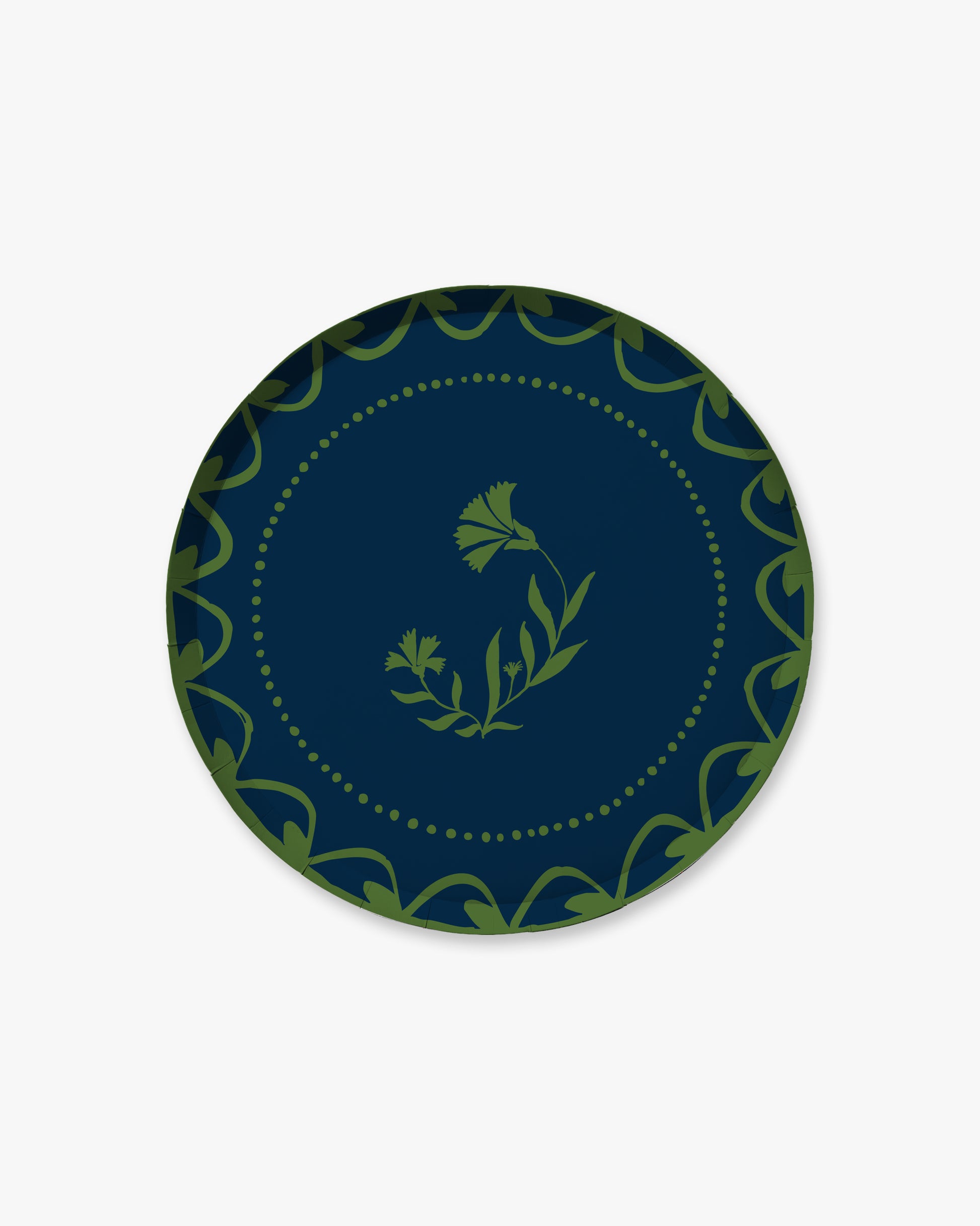 Navy blue plate with green decorative border and floral design 