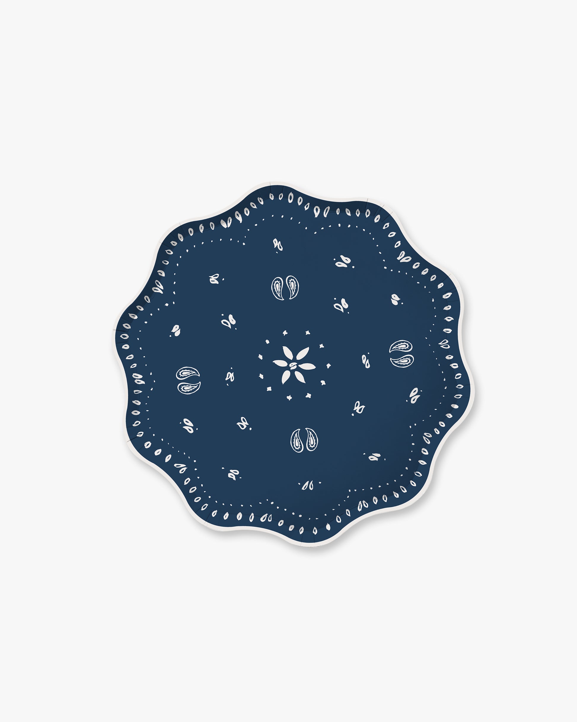Navy blue decorative plate with white patterns on a white background