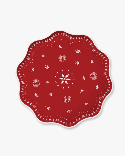 A red plate with a bandana brint