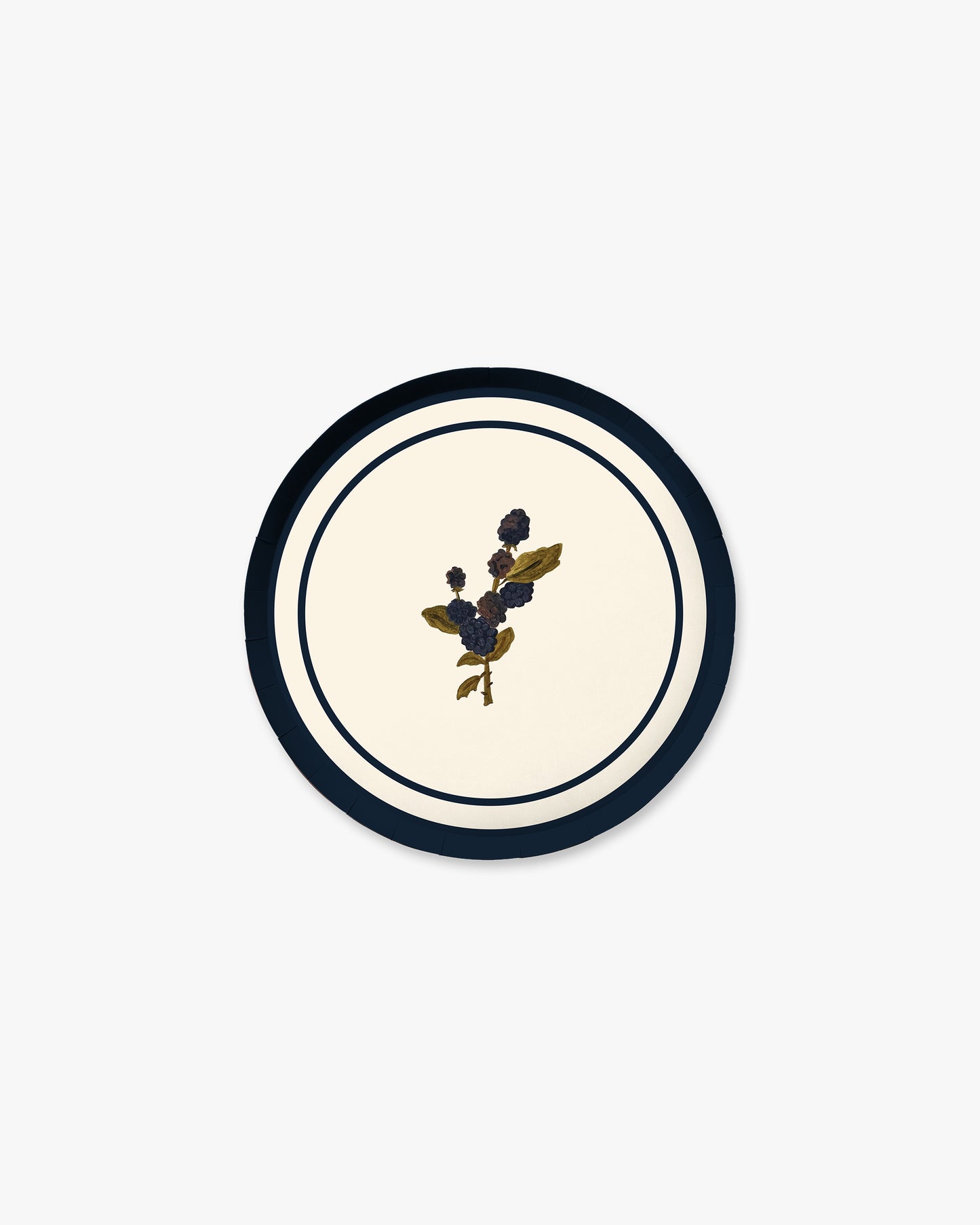 A round decorative plate with a cream center, a navy blue outer ring, and a small central blackberry motif.