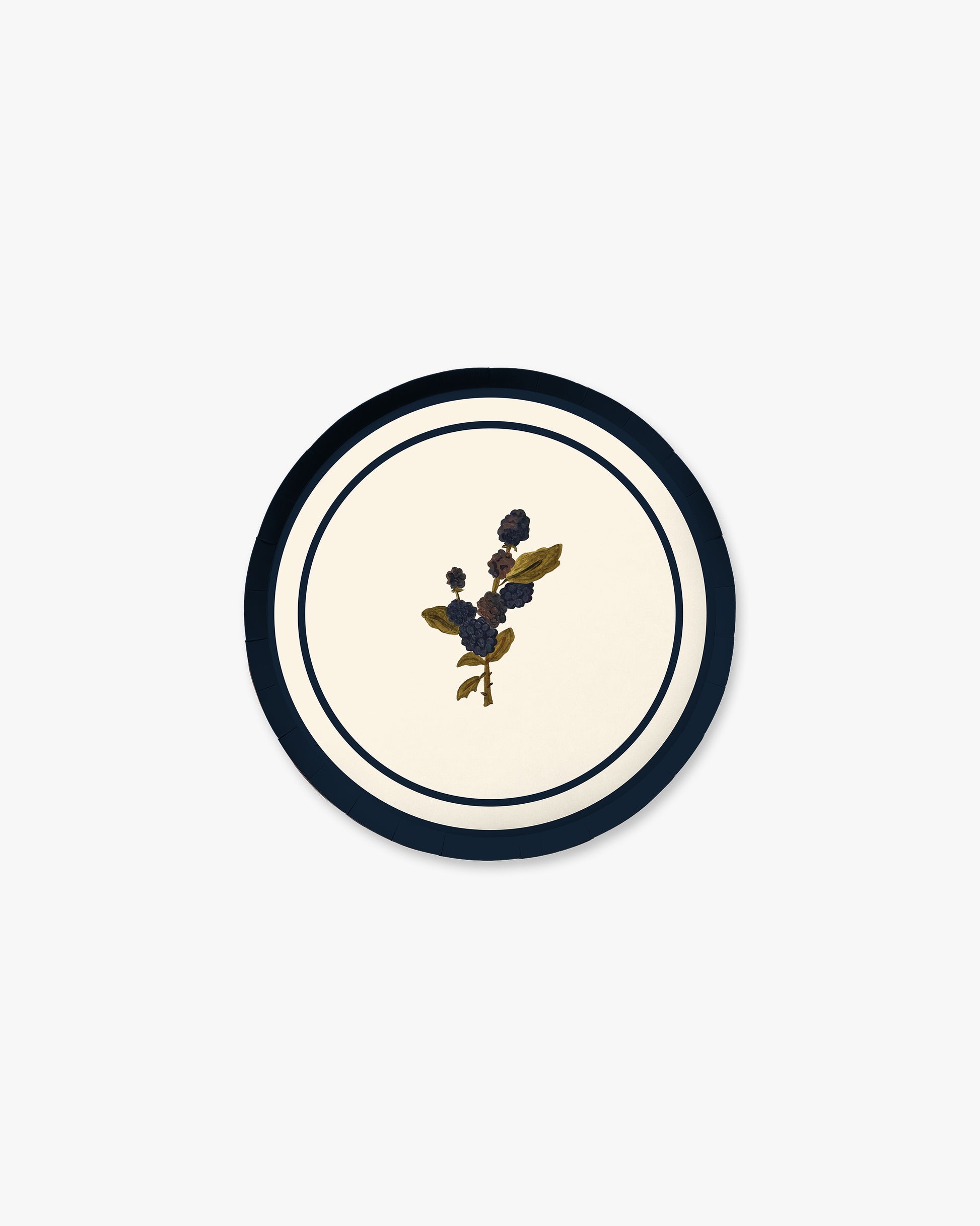 A round decorative plate with a cream center, a navy blue outer ring, and a small central blackberry motif.