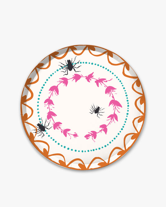 7-inch round decorative paper plate with a cream background, orange floral border, pink floral wreath, teal dotted circle, and three black spider illustrations.