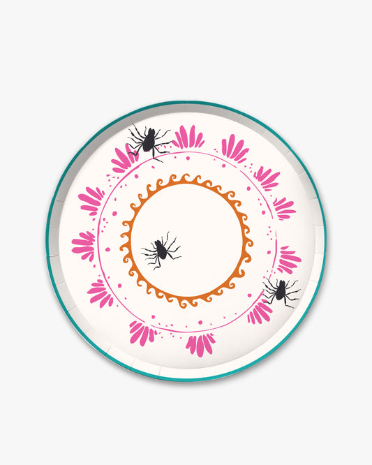 7-inch round decorative paper plate with a cream background, orange sun border, pink floral wreath, teal dotted circle, and three black spider illustrations.