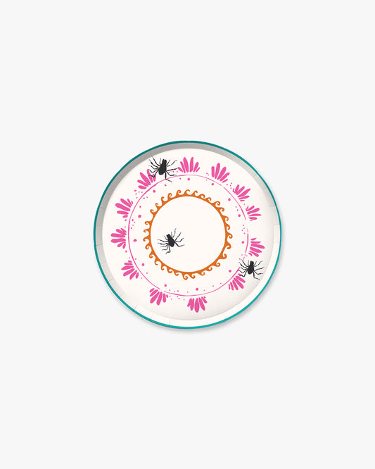 7-inch round decorative paper plate with a cream background, orange sun border, pink floral wreath, teal dotted circle, and three black spider illustrations.