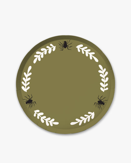 Olive colored paper plate with white colored fern stem border and black spider detailing. 