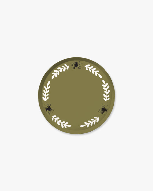 Olive colored paper plate with white colored fern stem border and black spider detailing. 