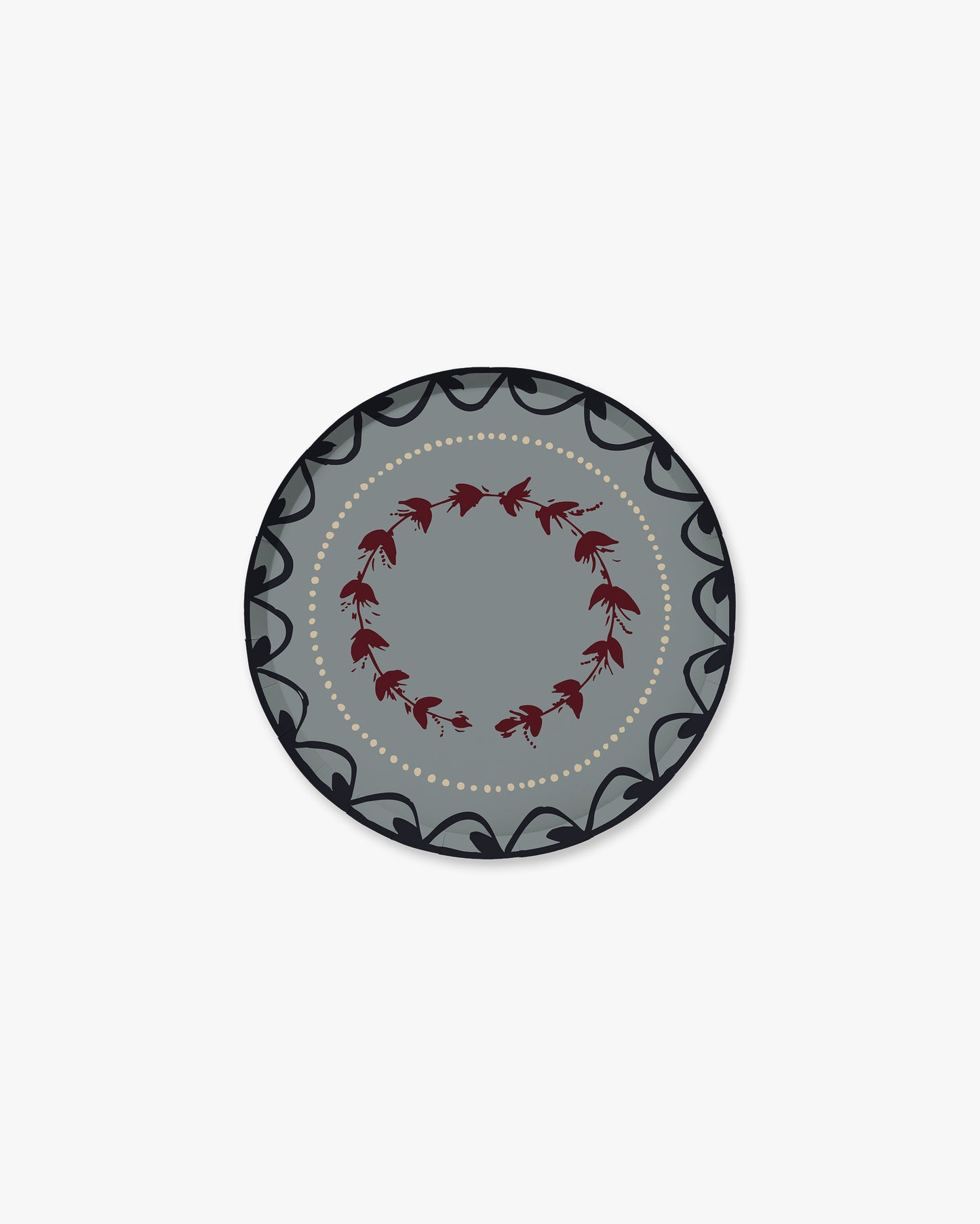 A round decorative plate with a gray center, a ring of small red floral motifs, and a dark gray outer border with black scrollwork and a dotted inner line, shown on a plain light gray background.