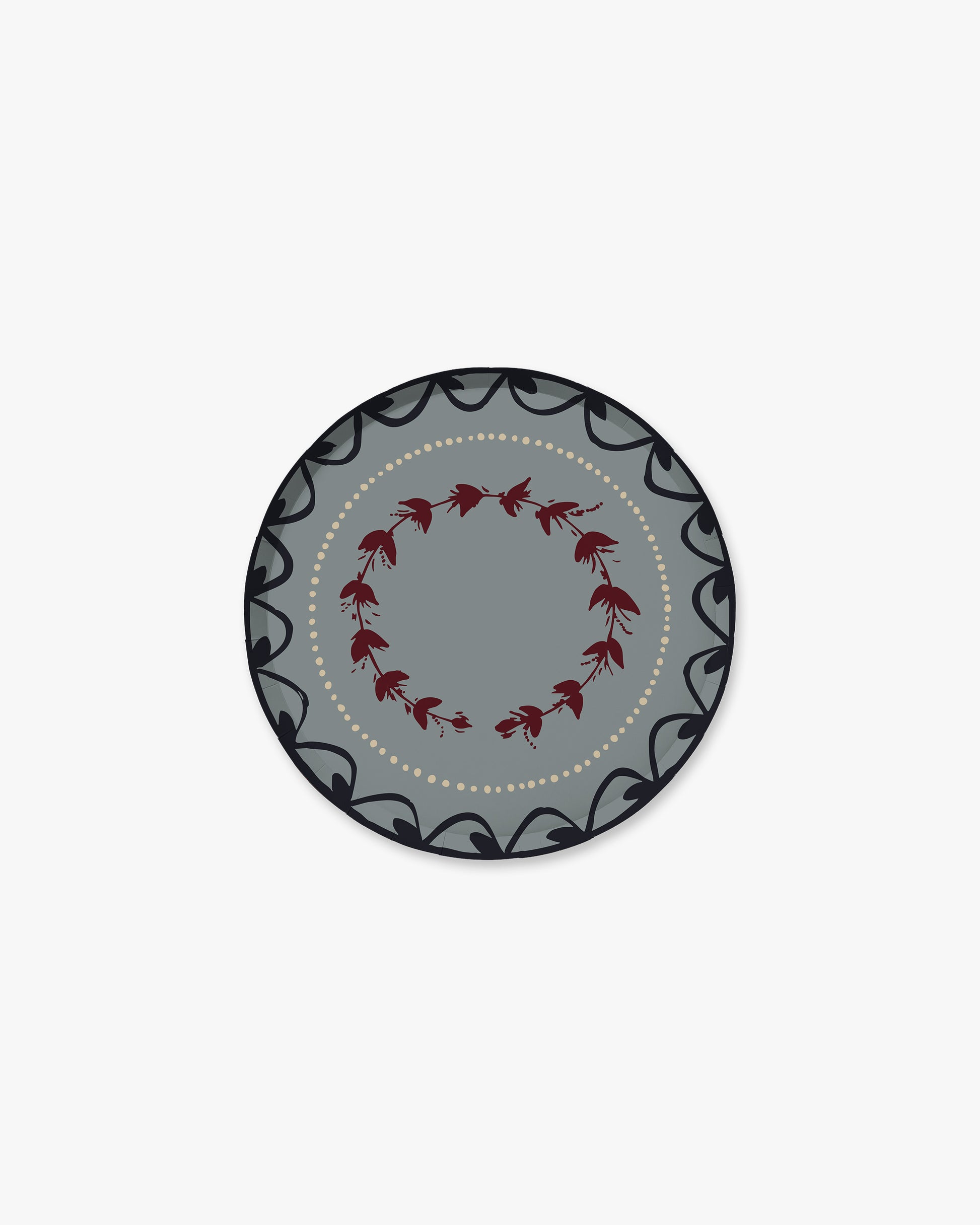 A round decorative plate with a gray center, a ring of small red floral motifs, and a dark gray outer border with black scrollwork and a dotted inner line, shown on a plain light gray background.