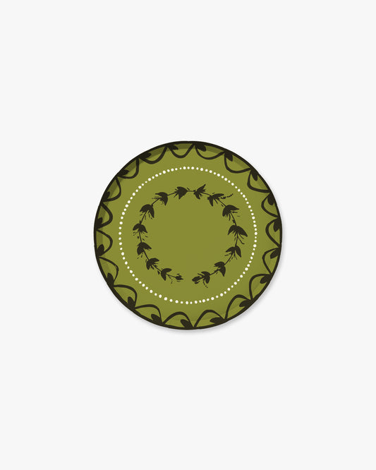 7-inch round decorative paper plate in olive green with a dark  floral border, inner floral wreath, and white dotted circle.