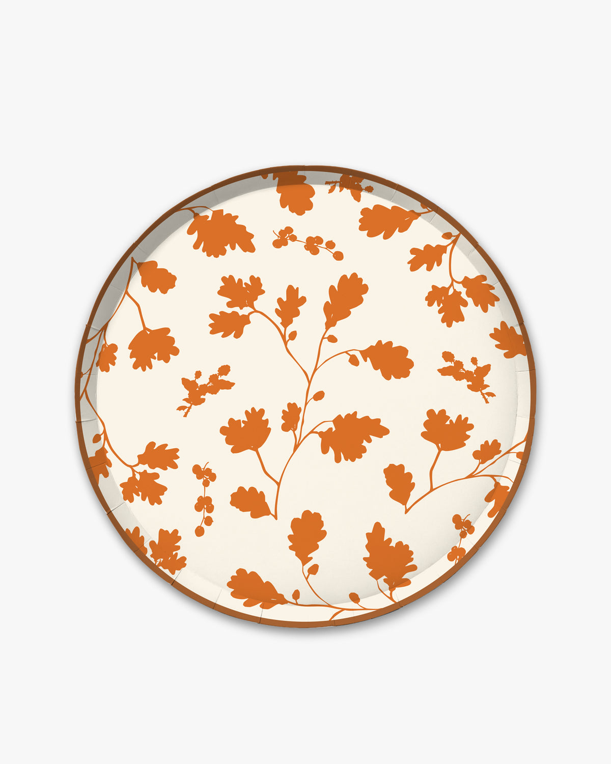 Cream paper plate with orange silhouette pattern of fall leaves. 