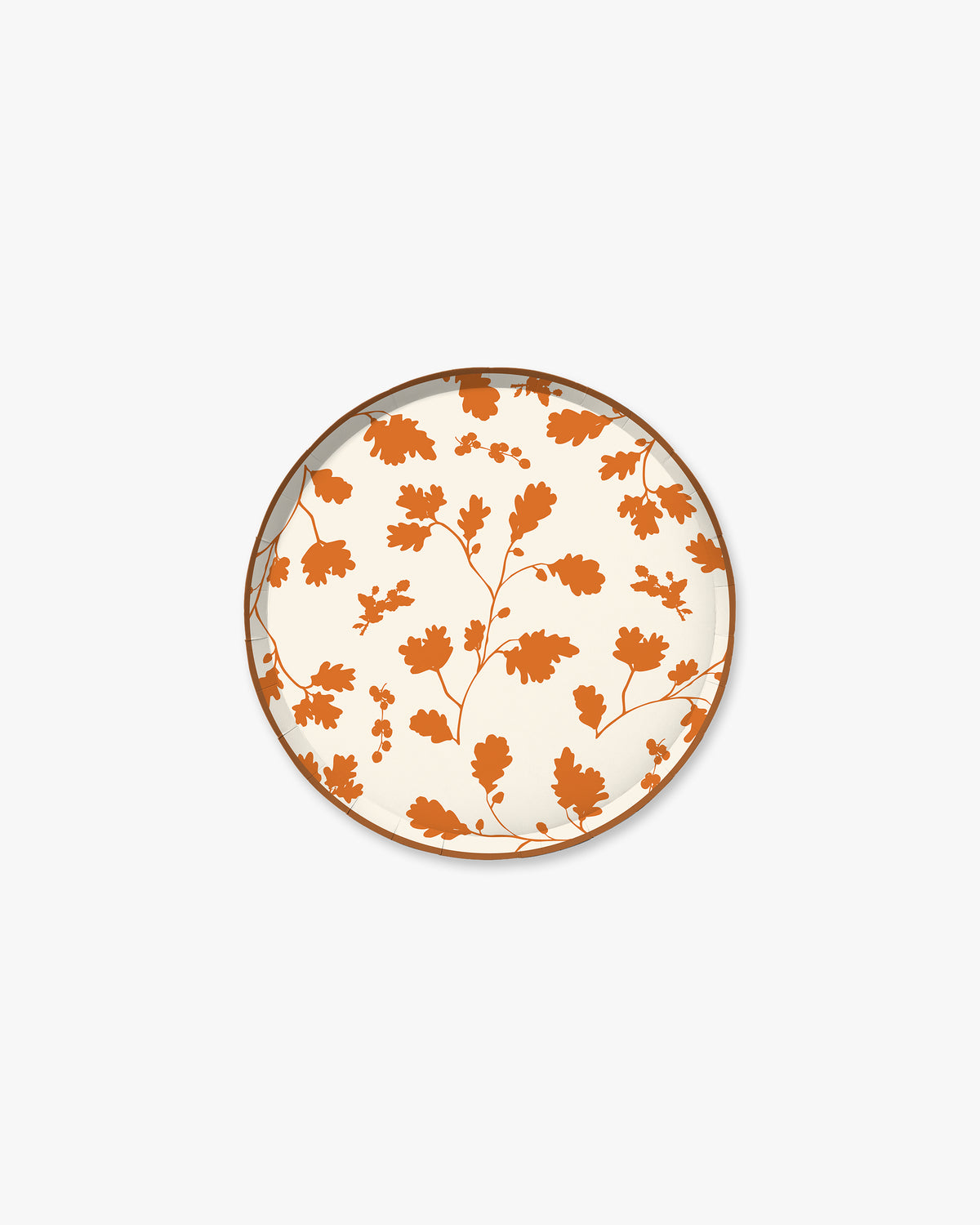 Cream paper plate with orange silhouette pattern of fall leaves. 