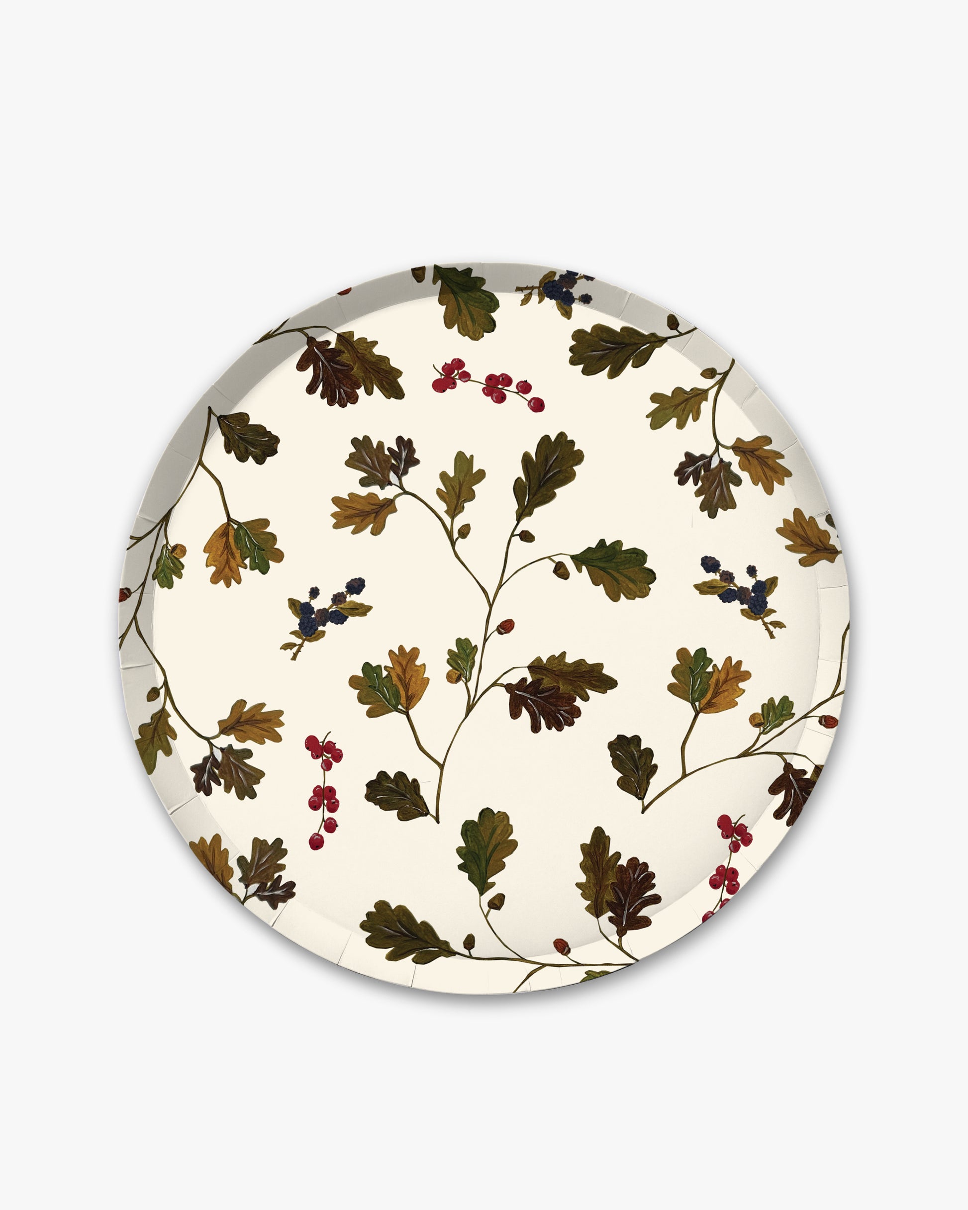A round paper plate with a vintage botanical pattern of oak leaves and small berries on an off-white background, shown against a light gray studio backdrop.
