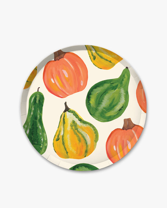White paper plate with fall vegetables pattern including pumpkin, squash, and gourd.
