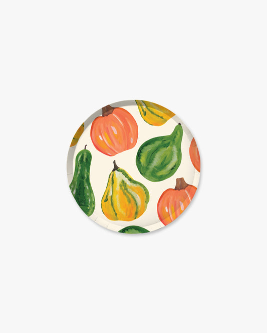 White paper plate with fall vegetables pattern including pumpkin, squash, and gourd.