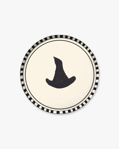 9-inch round decorative paper plate with a cream center, black witch hat silhouette, black double-line border, and black-and-white striped rim.