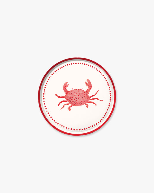 A white plate with a red crab in the center