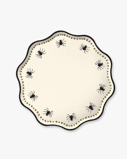 Cream colored paper plate with scalloped edges featuring a dotted olive border and black spider detailing.