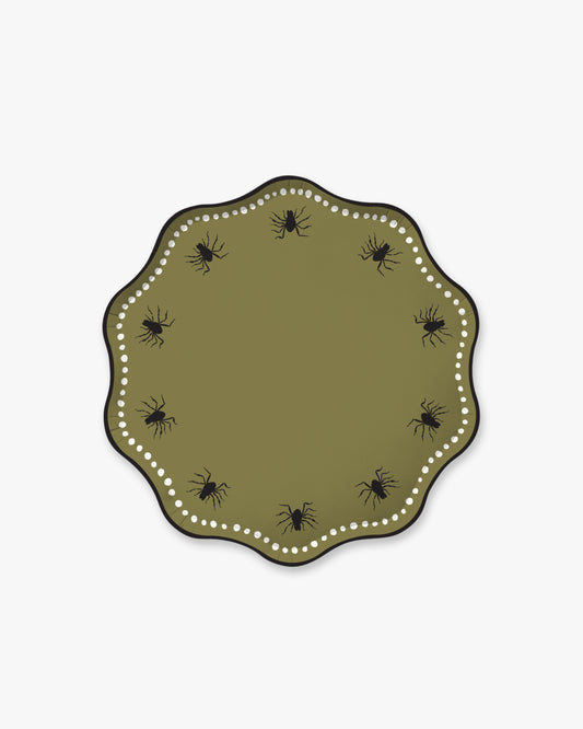 Olive colored paper plate with scalloped edges featuring a dotted white border and black spider detailing.
