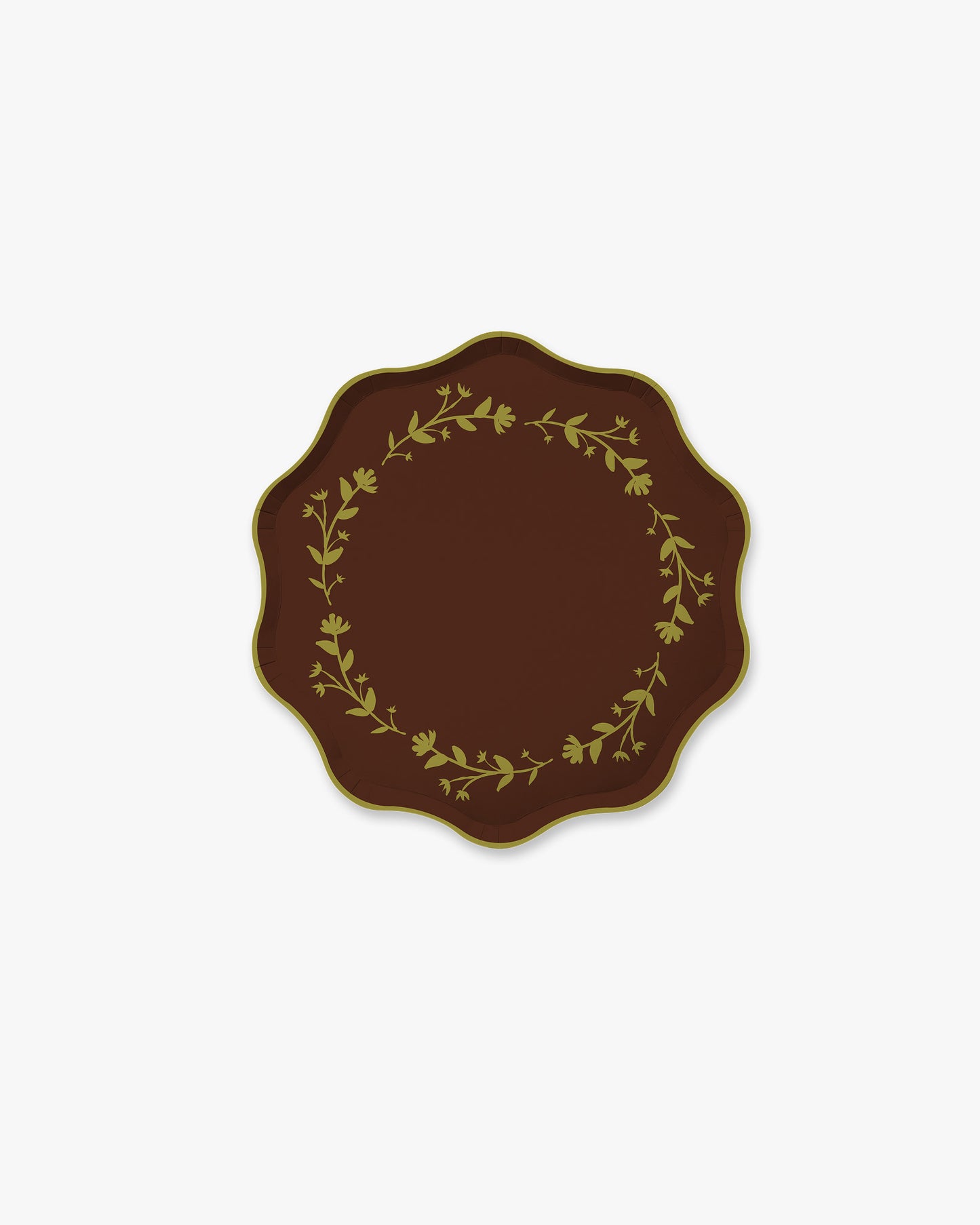 A scalloped plate or tray in dark brown with a floral wreath border and a thin green rim, centered on a light gray background. 