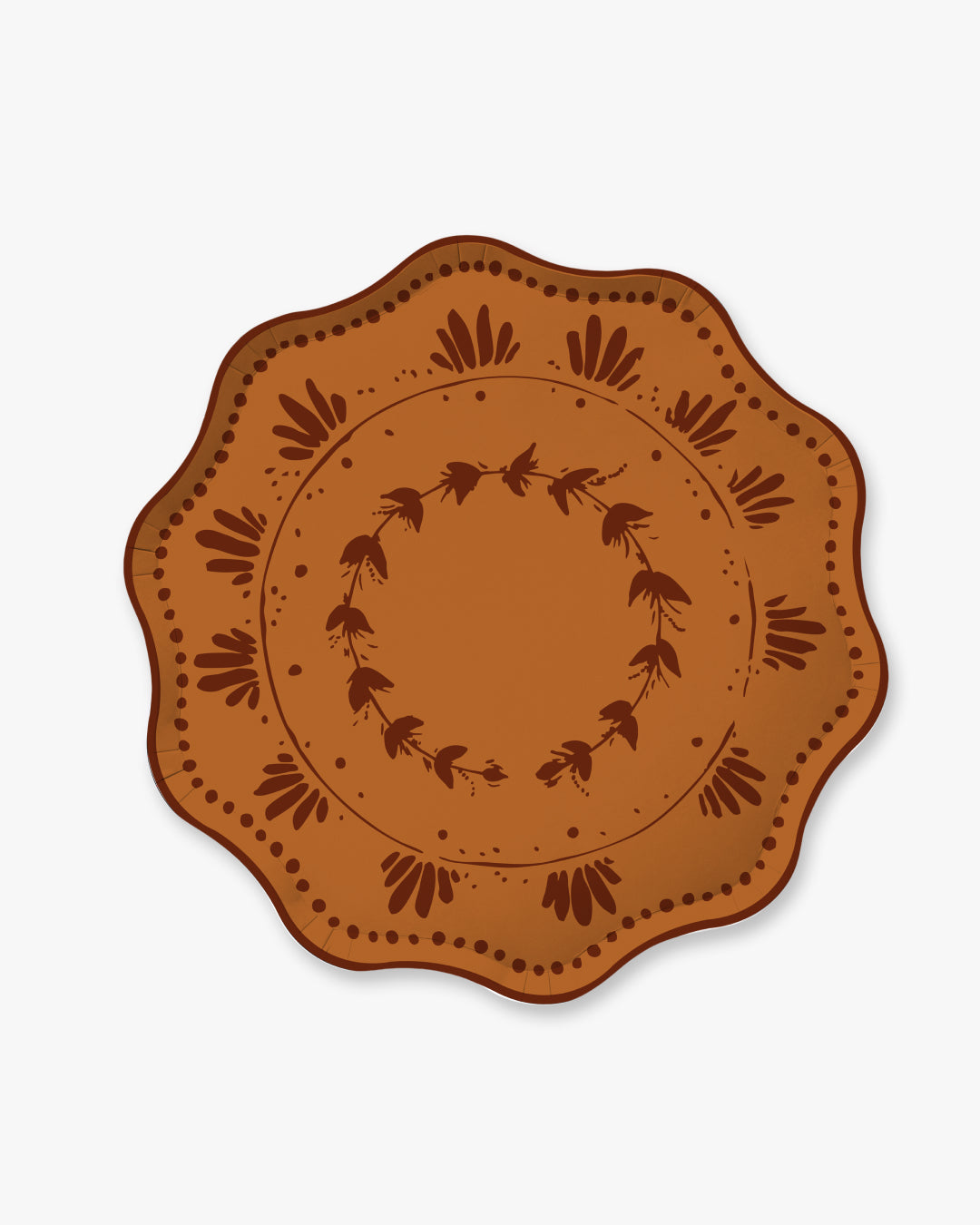 A round decorative plate with a scalloped edge, featuring a warm terracotta orange-brown center and a dark brown printed floral wreath pattern, shown on a light gray background.