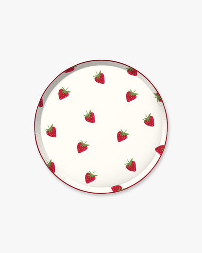 Round plate with strawberry pattern on a white background