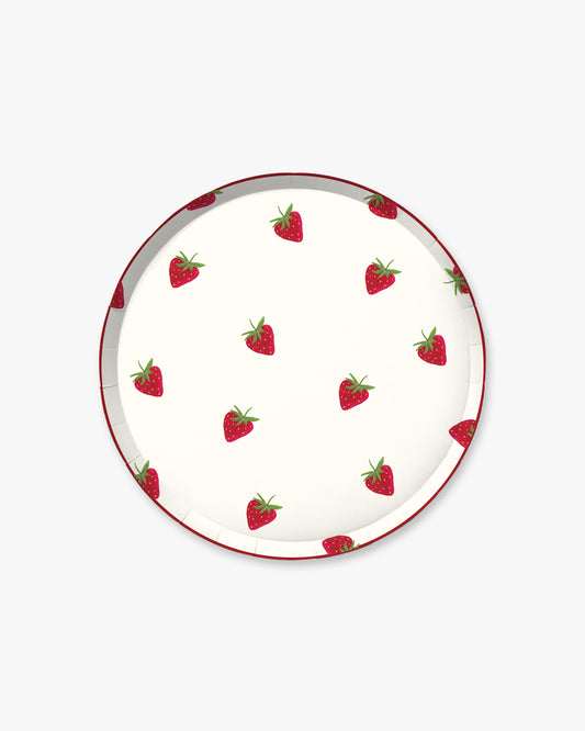 Round plate with strawberry pattern on a white background