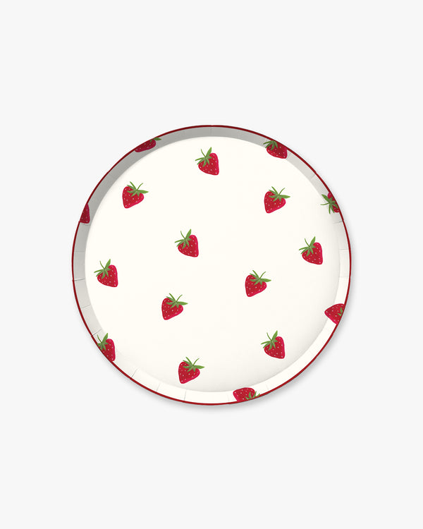 Round plate with strawberry pattern on a white background