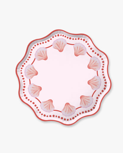 Decorative plate with shell pattern on a white background