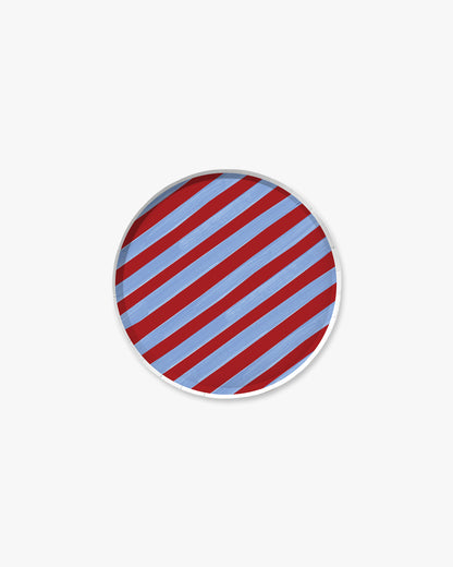 round plate with red and blue diagonal stripes on a white background