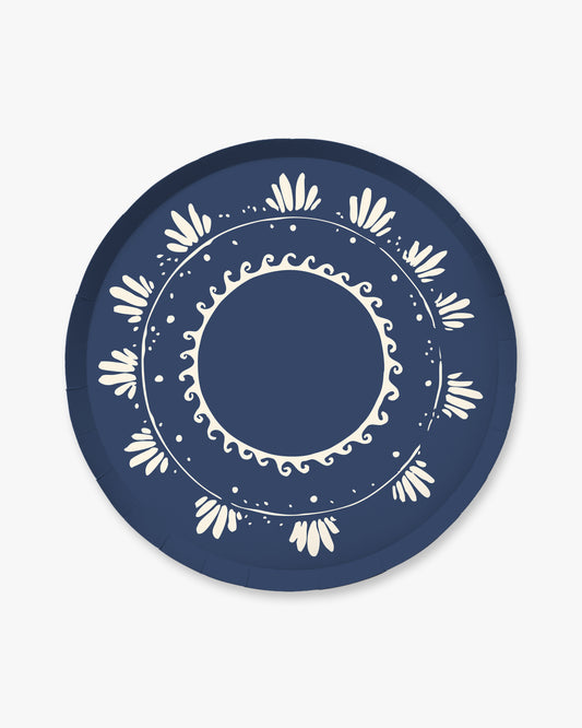 Navy blue plate with white decorative pattern on a light gray background