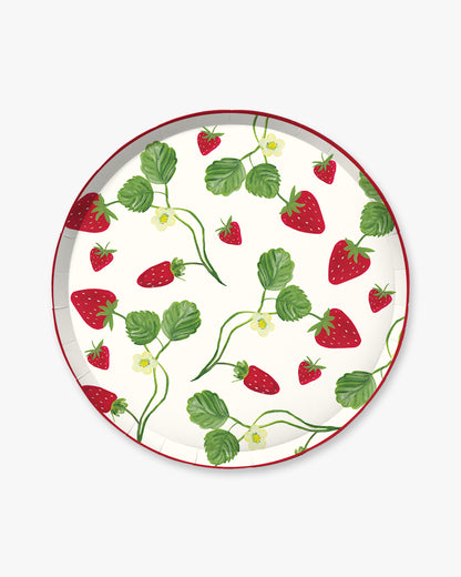 A white plate with strawberries on the vine