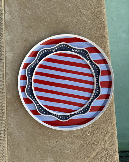 Blue and red striped plates next to a pool