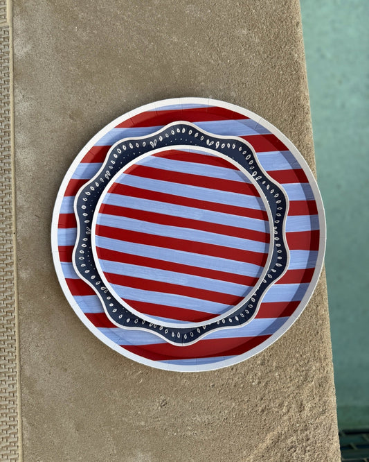 Blue and red striped plates next to a pool