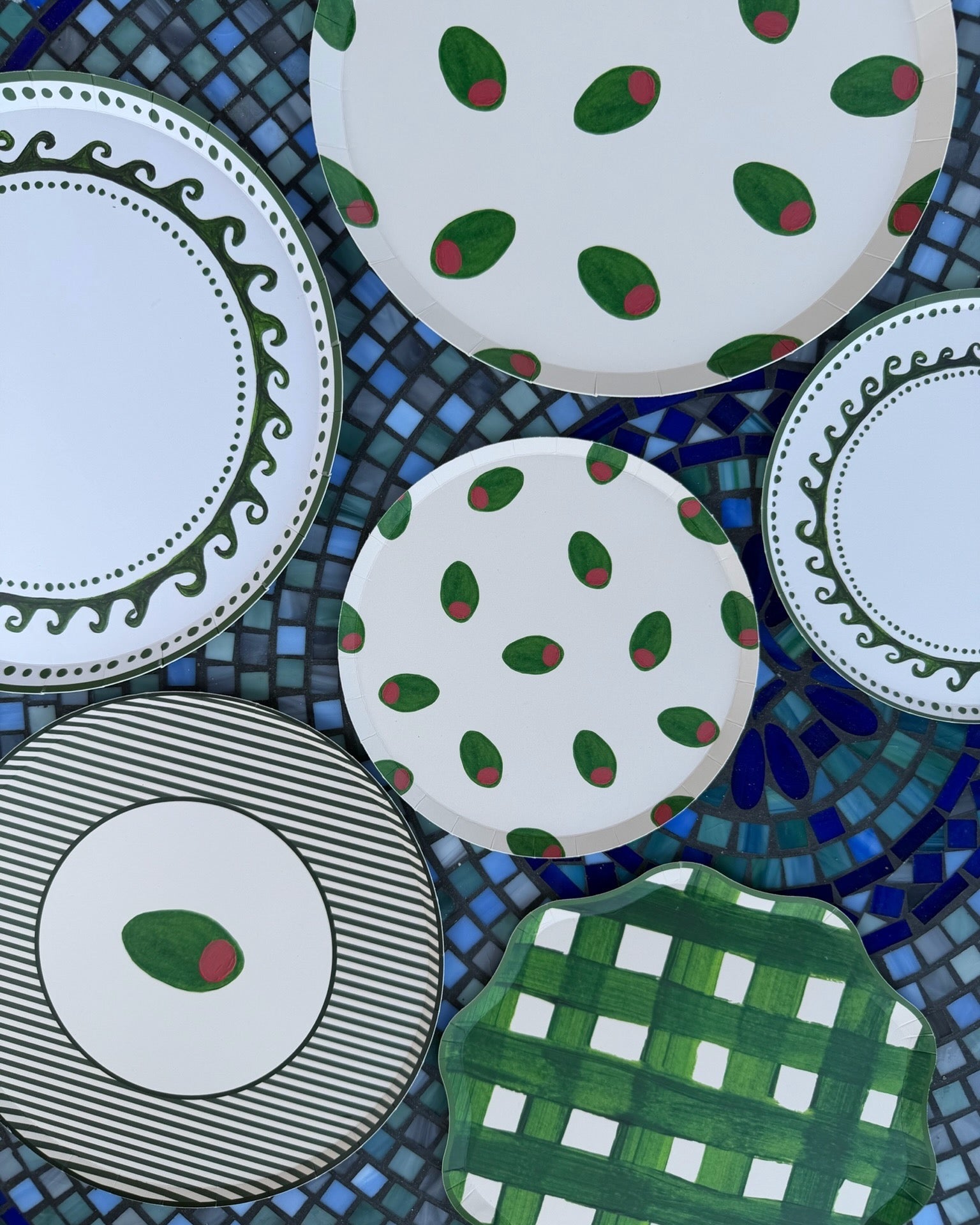 decorative plates displayed on a tile table