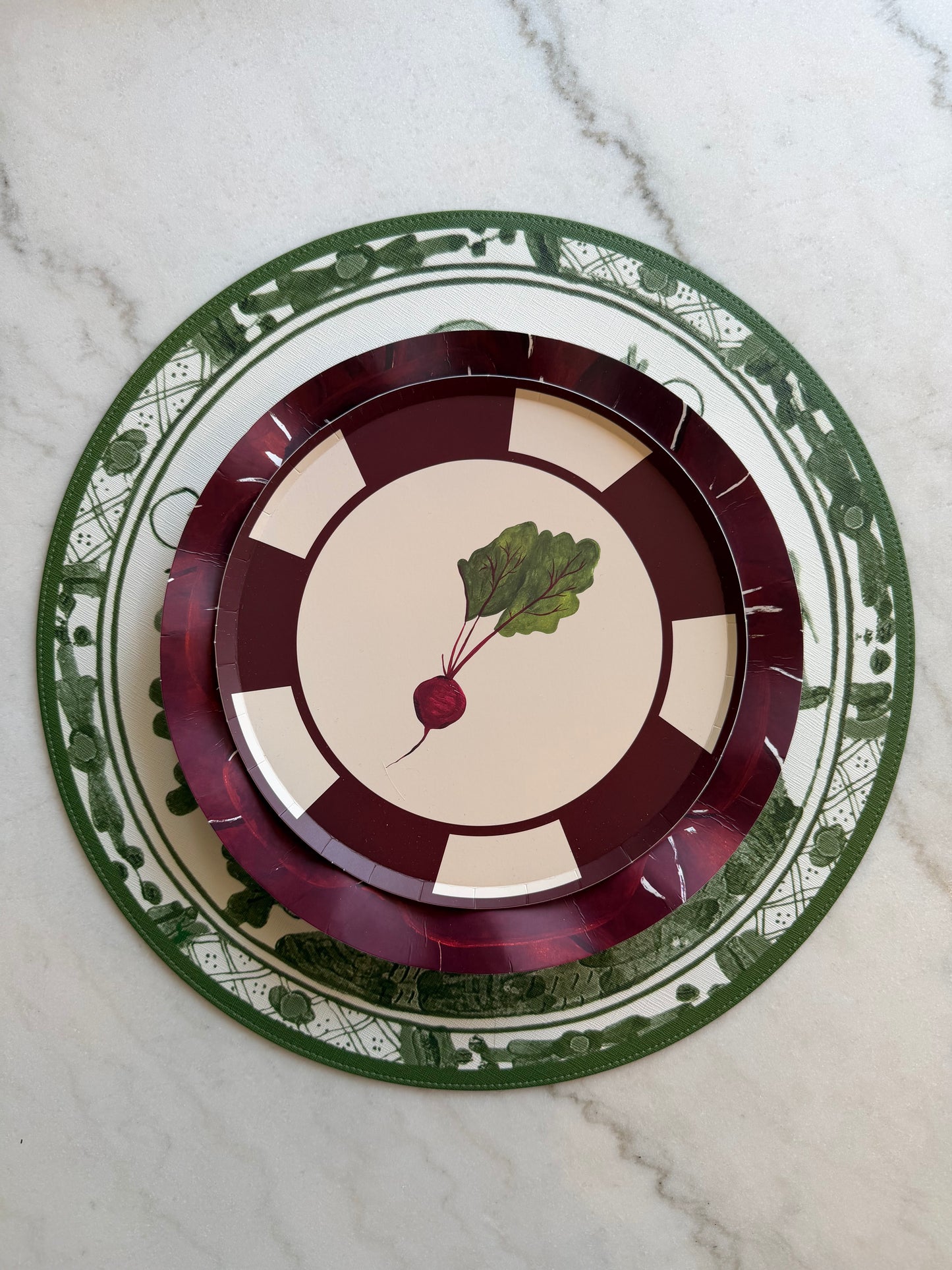 Decorative plate with a radish design on a marble surface