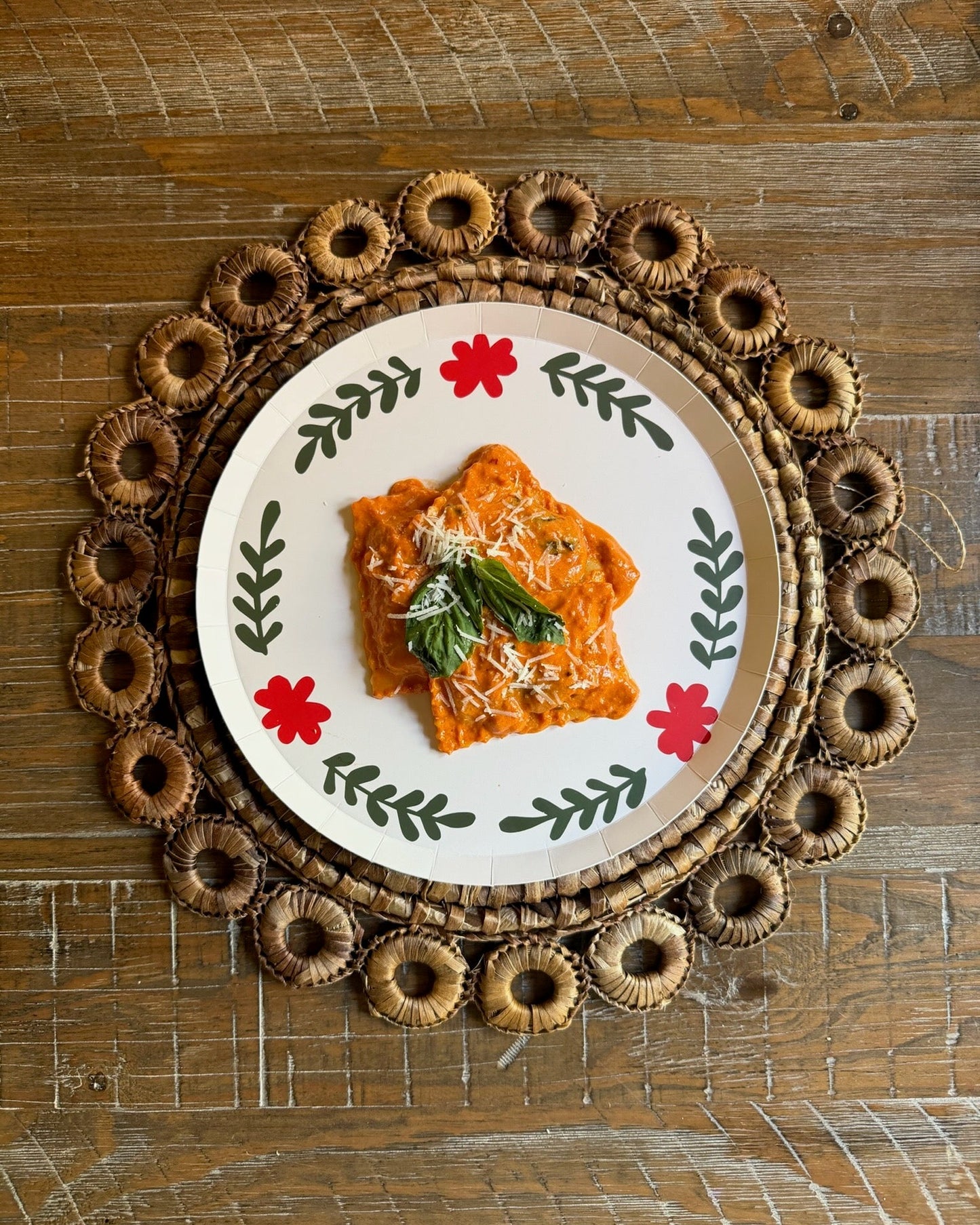 a plate with pasta on a wooden table
